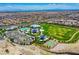 Aerial photo showcasing the community park, pool, and clubhouse amidst a neighborhood landscape at 8668 Hartmont St, Las Vegas, NV 89166