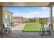 Beautiful backyard with brick pavers, artificial turf, and landscaping, offering an ideal outdoor retreat at 8668 Hartmont St, Las Vegas, NV 89166