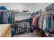 Spacious walk-in closet with built-in shelving and ample storage space at 8668 Hartmont St, Las Vegas, NV 89166