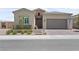 Charming single-Gathering home featuring a two-car garage and well-manicured front yard at 8668 Hartmont St, Las Vegas, NV 89166
