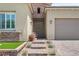 Close-up of the welcoming front entry with decorative brickwork and desert-style landscaping at 8668 Hartmont St, Las Vegas, NV 89166