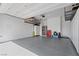 Well-organized garage with overhead racks and plenty of space for vehicles and storage at 8668 Hartmont St, Las Vegas, NV 89166