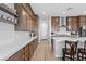 Modern kitchen features sleek countertops, stylish cabinets and stainless steel appliances, perfect for culinary enthusiasts at 8668 Hartmont St, Las Vegas, NV 89166