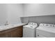 Functional laundry room with countertop, sink, washer, and dryer at 8668 Hartmont St, Las Vegas, NV 89166