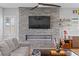 Inviting living room featuring a fireplace, modern decor, and neutral tones at 8668 Hartmont St, Las Vegas, NV 89166