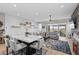 Open-concept living space with a dining area and comfortable seating, showcasing a fireplace at 8668 Hartmont St, Las Vegas, NV 89166