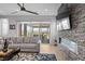Comfortable living room with a sliding glass door leading to an outdoor covered patio with views at 8668 Hartmont St, Las Vegas, NV 89166