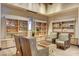 Inviting lounge area with comfortable seating and custom built-in shelving for display at 8668 Hartmont St, Las Vegas, NV 89166