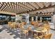 Enjoy outdoor dining on the patio, which features a pergola, television, and fireplace at 8668 Hartmont St, Las Vegas, NV 89166