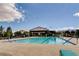 Resort-style swimming pool with lane markers, lounge chairs, and mountain views at 8668 Hartmont St, Las Vegas, NV 89166
