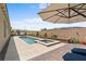 Relaxing backyard featuring a pool, spa, and plenty of space for lounging at 8668 Hartmont St, Las Vegas, NV 89166