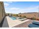 Backyard pool area with spa and lounge chairs, perfect for relaxation and entertainment at 8668 Hartmont St, Las Vegas, NV 89166