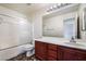 Bathroom featuring vanity with ample countertop space, a shower, and tile flooring at 8872 Perfect Diamond Ct, Las Vegas, NV 89129