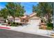 Charming single-Gathering home featuring a two-car garage, mature landscaping, and a spacious driveway at 8872 Perfect Diamond Ct, Las Vegas, NV 89129