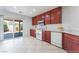 Kitchen features a sliding glass door to the backyard and white appliances at 8872 Perfect Diamond Ct, Las Vegas, NV 89129