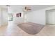 Bright and airy living room with tile flooring, ceiling fan, and open floorplan at 8872 Perfect Diamond Ct, Las Vegas, NV 89129