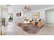 Bright living room features a comfortable sofa, stylish decor, and tile flooring throughout at 8872 Perfect Diamond Ct, Las Vegas, NV 89129