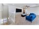 Inviting loft with plush carpeting, a comfy blue sofa, and a mounted TV at 8872 Perfect Diamond Ct, Las Vegas, NV 89129
