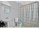 Cozy full bathroom featuring patterned shower curtain and neutral decor with window blinds at 9010 Wine Cellar Ave, Las Vegas, NV 89148