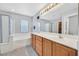 This bathroom features double sinks, a soaking tub, and a separate shower at 9010 Wine Cellar Ave, Las Vegas, NV 89148