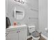 Well-lit half bathroom features modern fixtures, a stylish mirror, and neutral decor at 9010 Wine Cellar Ave, Las Vegas, NV 89148