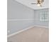 Inviting bedroom with soft carpet, ceiling fan, and natural light at 9010 Wine Cellar Ave, Las Vegas, NV 89148