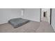 This spacious bedroom offers neutral carpeting and an open doorway at 9010 Wine Cellar Ave, Las Vegas, NV 89148