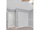 Neutral toned bedroom with large closet and adjacent door at 9010 Wine Cellar Ave, Las Vegas, NV 89148