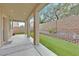 Spacious covered patio with concrete flooring and artificial grass, offering a relaxing outdoor space at 9010 Wine Cellar Ave, Las Vegas, NV 89148