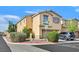 Two-story home with well-maintained landscaping, a two-car garage, and a neatly paved driveway at 9010 Wine Cellar Ave, Las Vegas, NV 89148