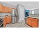 Modern kitchen with stainless steel appliances and natural wood cabinets offers style and function at 9010 Wine Cellar Ave, Las Vegas, NV 89148