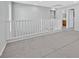 Upstairs loft offers a flexible living space with modern white railings and neutral tones at 9010 Wine Cellar Ave, Las Vegas, NV 89148
