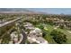 Stunning aerial view of townhomes nestled by a golf course in a vibrant, upscale community at 9112 Vista Greens Way # 204, Las Vegas, NV 89134