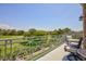 Relax on the balcony with views of the golf course and mature trees, perfect for outdoor entertaining at 9112 Vista Greens Way # 204, Las Vegas, NV 89134