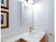 Stylish bathroom with a modern sink, a light-colored vanity, and a decorative mirror at 9112 Vista Greens Way # 204, Las Vegas, NV 89134