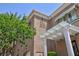 Condominium building with a stucco facade and desert landscaping at 9112 Vista Greens Way # 204, Las Vegas, NV 89134