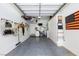 Clean garage with ample storage, custom lighting, and epoxy floors at 9112 Vista Greens Way # 204, Las Vegas, NV 89134