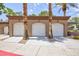 Row of attached garages with well-maintained exteriors and landscaping at 9112 Vista Greens Way # 204, Las Vegas, NV 89134