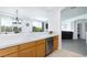 Bright kitchen featuring light wood cabinets, stainless steel appliances, and a breakfast bar at 9112 Vista Greens Way # 204, Las Vegas, NV 89134