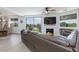 Inviting living room with fireplace, modern sofa, and golf course views at 9112 Vista Greens Way # 204, Las Vegas, NV 89134