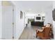 Bright, airy living room with modern furnishings and views of a golf course at 9112 Vista Greens Way # 204, Las Vegas, NV 89134