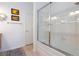 Clean bathroom with a tiled shower featuring a glass door and chrome fixtures at 9112 Vista Greens Way # 204, Las Vegas, NV 89134