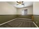 Bedroom featuring carpeted floors, paneled walls, and a ceiling fan at 9712 Red Horse St, Las Vegas, NV 89143