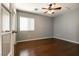 Bedroom featuring a ceiling fan, light gray walls, and hard surface floors at 9712 Red Horse St, Las Vegas, NV 89143