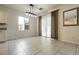 The dining area offers a sliding glass door, modern light fixture, and tile floors at 9712 Red Horse St, Las Vegas, NV 89143