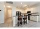 Kitchen island with granite countertops, white cabinets, and stainless steel appliances at 9712 Red Horse St, Las Vegas, NV 89143