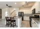 Kitchen island with granite countertops, white cabinets, and stainless steel appliances at 9712 Red Horse St, Las Vegas, NV 89143