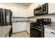 Kitchen with granite countertops, white cabinets, and stainless steel appliances at 9712 Red Horse St, Las Vegas, NV 89143