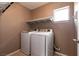 Laundry room with tile floors, shelving, and a side-by-side washer and dryer at 9712 Red Horse St, Las Vegas, NV 89143