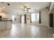 Spacious living room with tile floors, natural light, and an open floor plan at 9712 Red Horse St, Las Vegas, NV 89143
